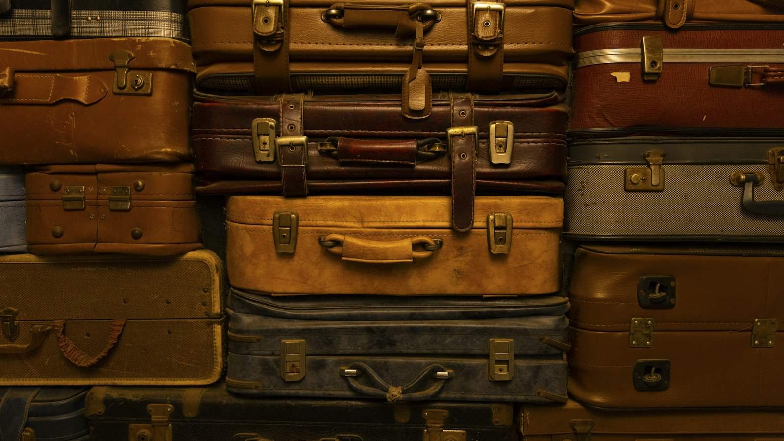 A neat stack of premium leather travel suitcases
